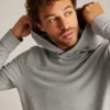 Sudadera con capucha de felpa elástica y botones a presión